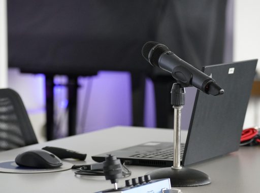 Laptop, conference table, mouse — DC Web Design Agency Focused on Engaging User Experiences